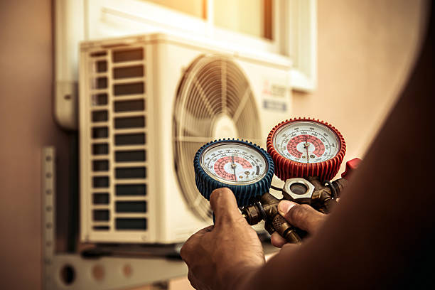 Professional Air Conditioning Service technician working in Freeland, WA